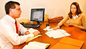 Attorney and client going over documents 
